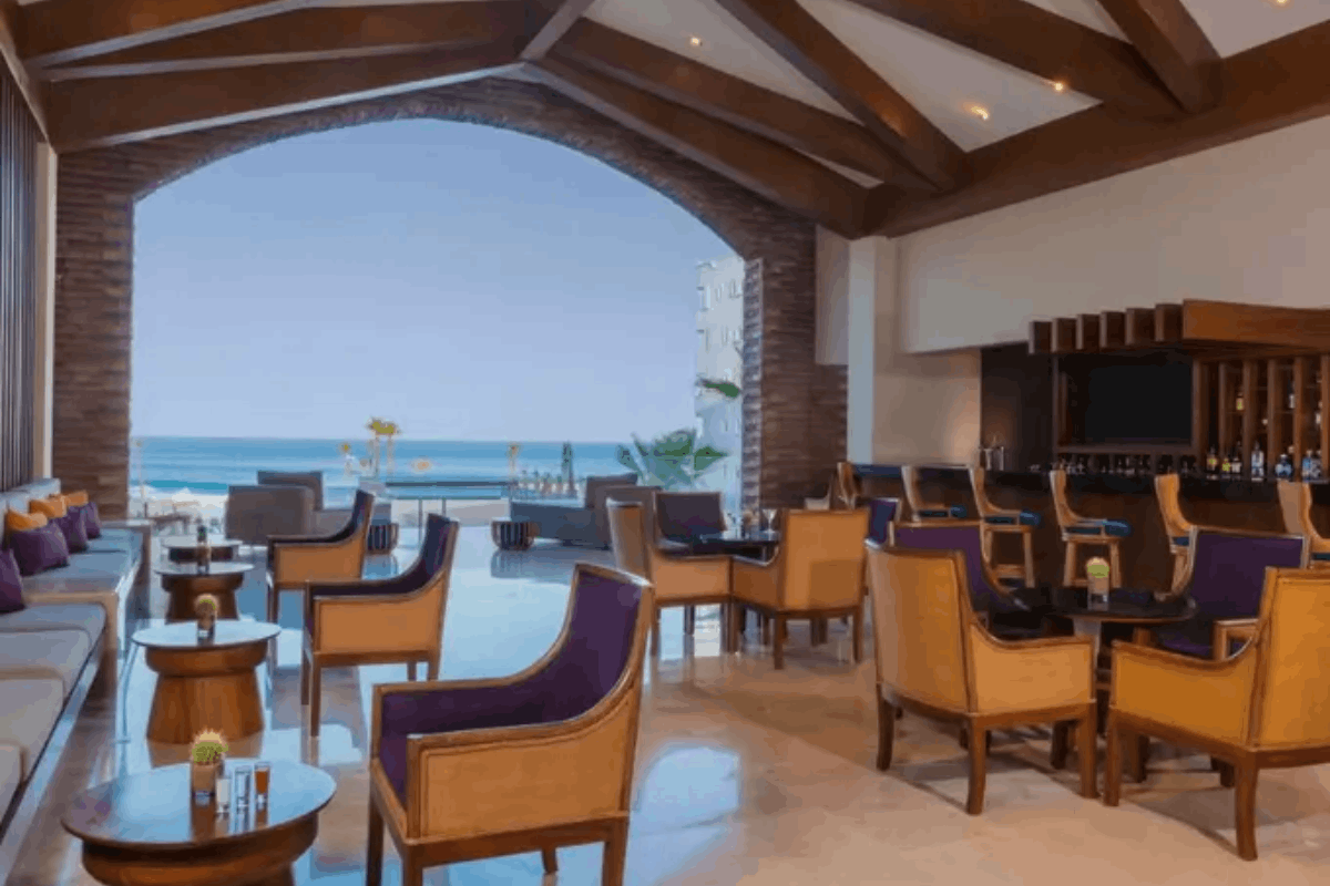 Lobby Bar at Krystal Grand Los Cabos with drinks, snacks and ocean view.